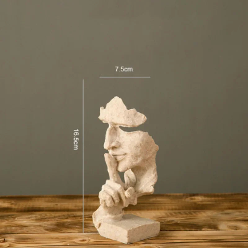 White stone sculpture with a finger raised in a "shushing" gesture on a gray background, with measurements: 7.5cm x 16.5cm x 7.cm
