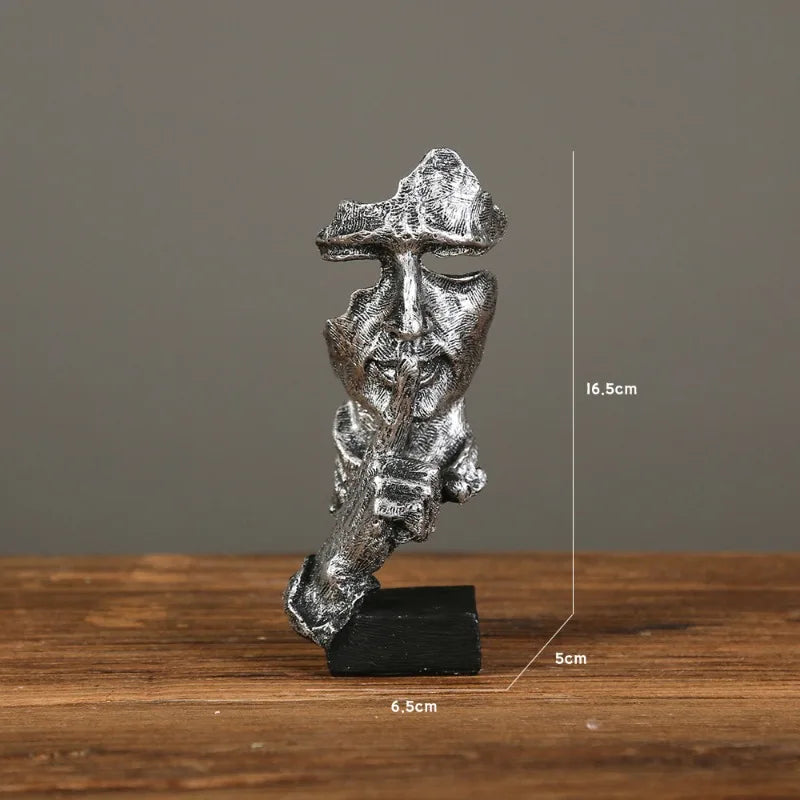 White stone sculpture with a finger raised in a "shushing" gesture on a gray background. Measurements: 6.5cm x 16.5cm x 5cm