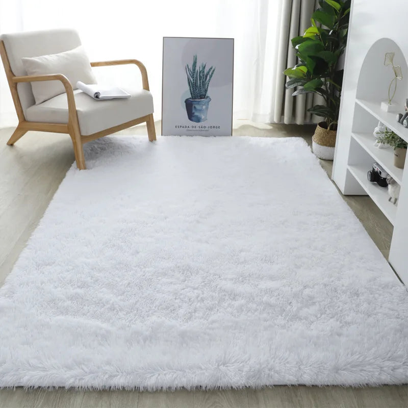 White shaggy rug in a living room setting with a chair, plant, and artwork.