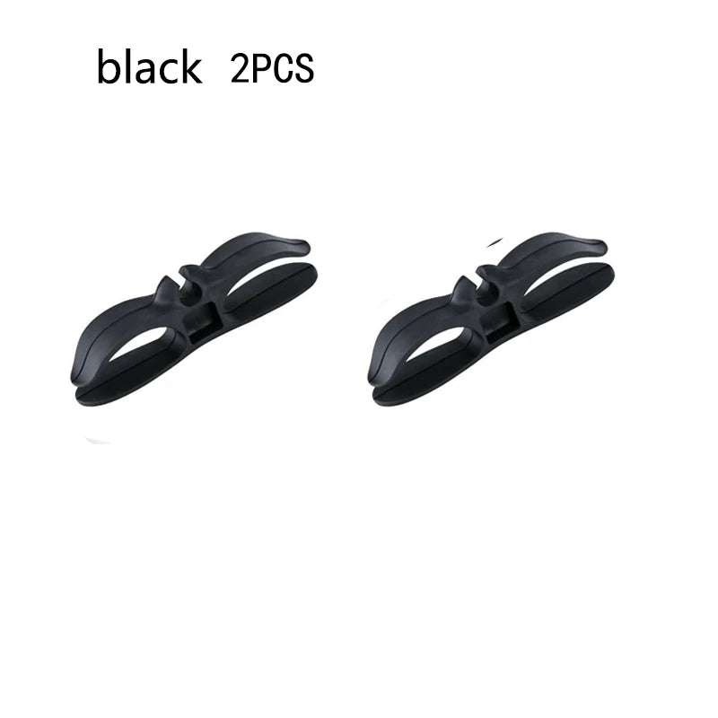 Two black hair clips on a white background with text indicating quantity.