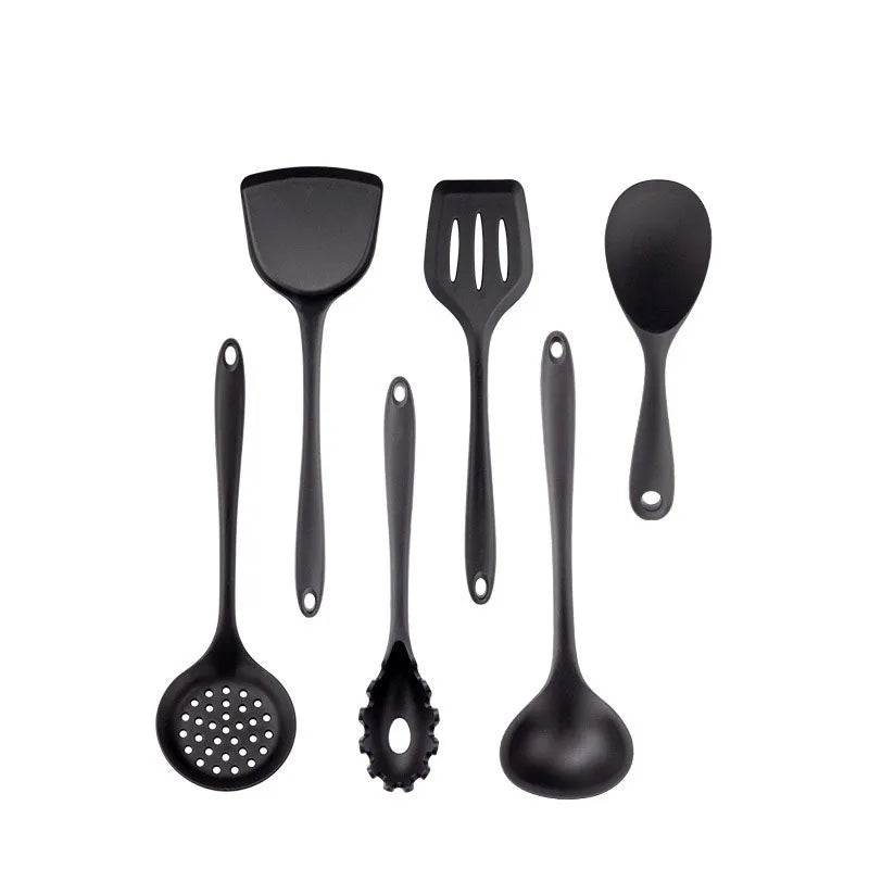 Set of black kitchen utensils including spatulas and ladles on a white background