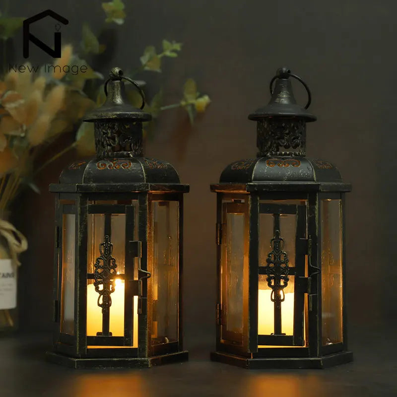 Two illuminated lanterns with intricate designs on a dark background