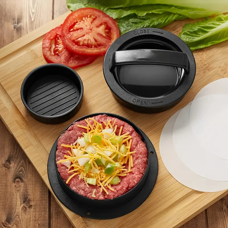Hamburger preparation on a wooden cutting board with ingredients and a black burger press.