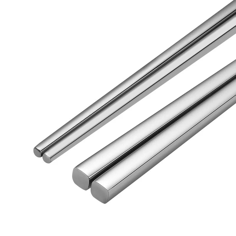Two silver cylindrical objects on a white background