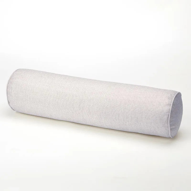 Light gray cylindrical pillow on a white background