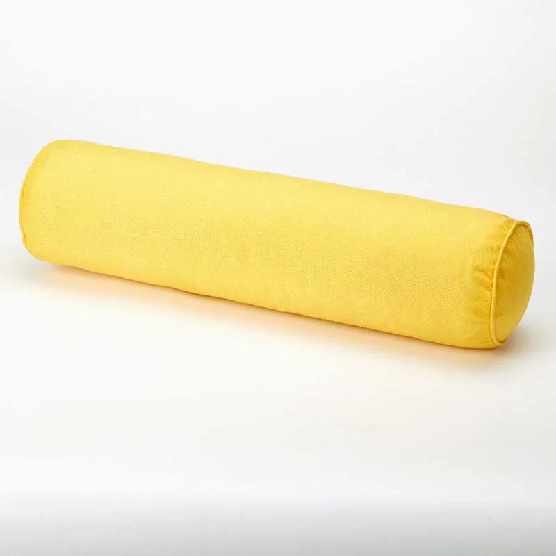 Yellow cylindrical pillow on a light gray background