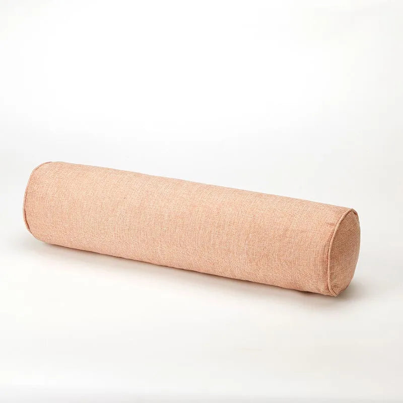 Light pink cylindrical pillow on a white background