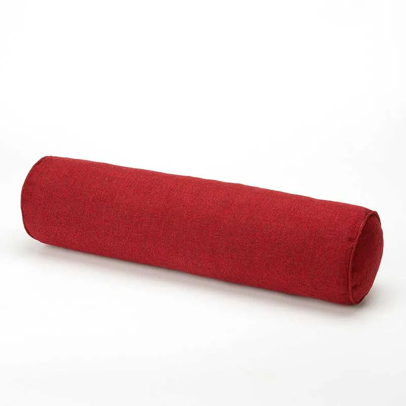Wine red cylindrical fabric pillow on a white background