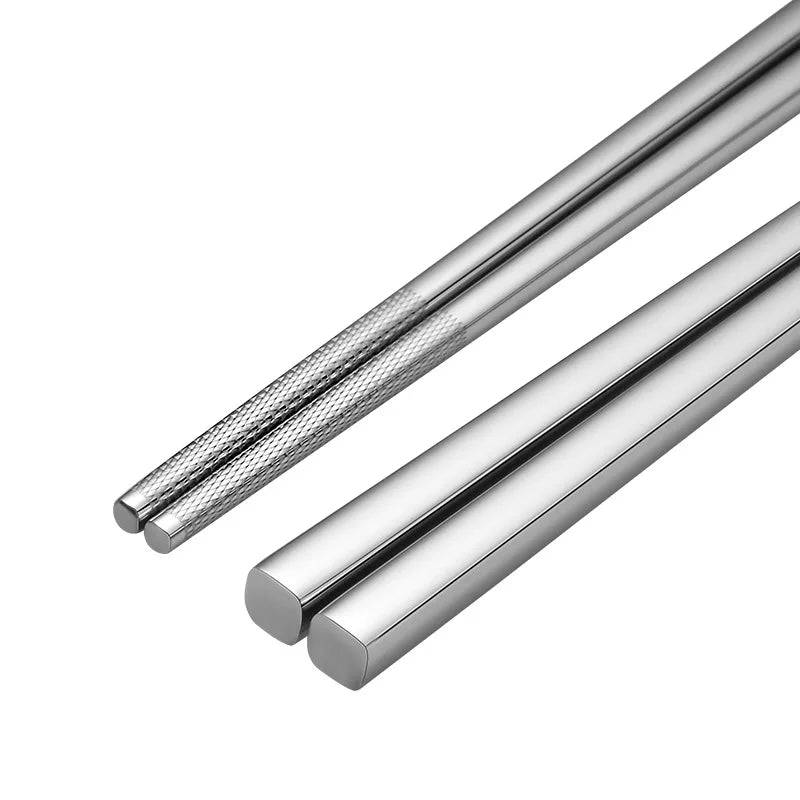 Two metal rods, one with a textured surface and the other smooth, on a white background.