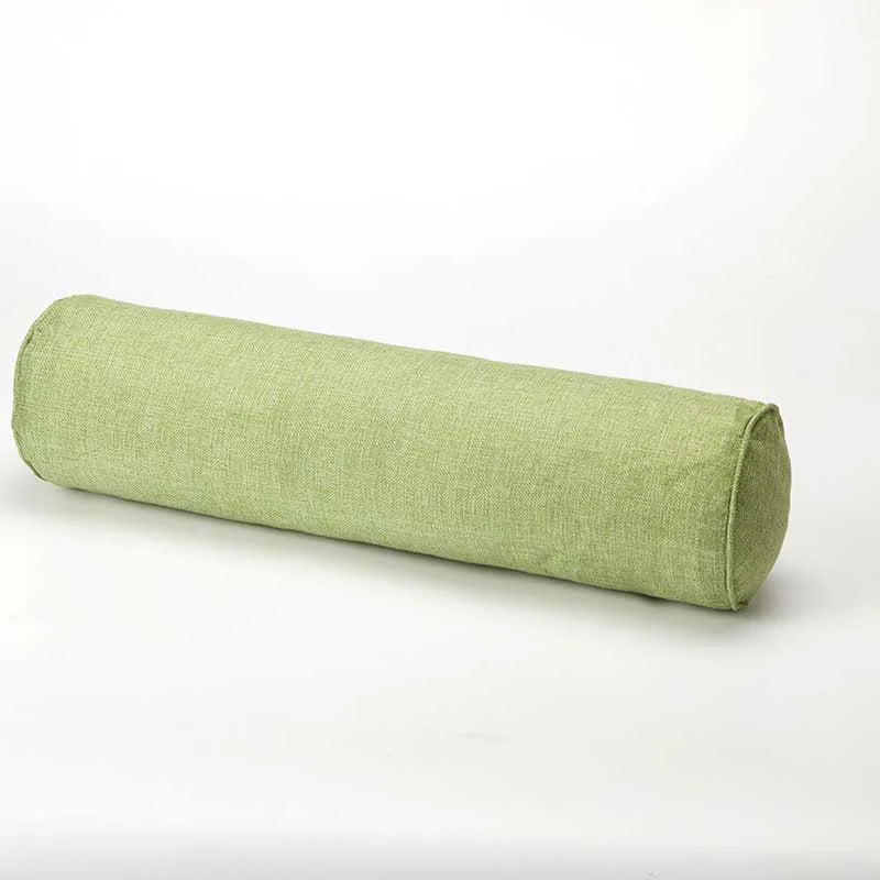 Green cylindrical pillow on a white background