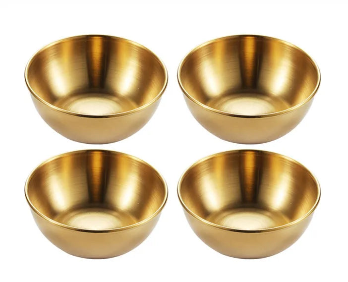 Four gold bowls on a white background