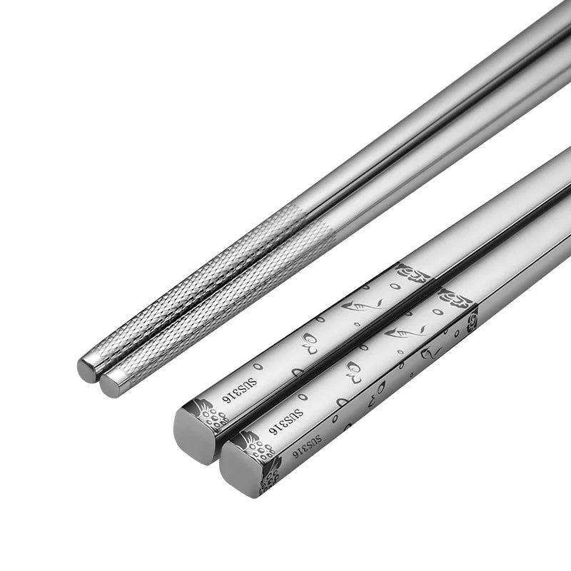 Pair of silver chopsticks on a white background