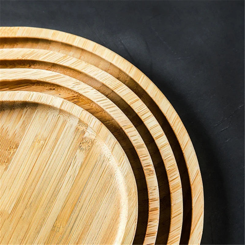 Set of wooden trays of different sizes on a black background