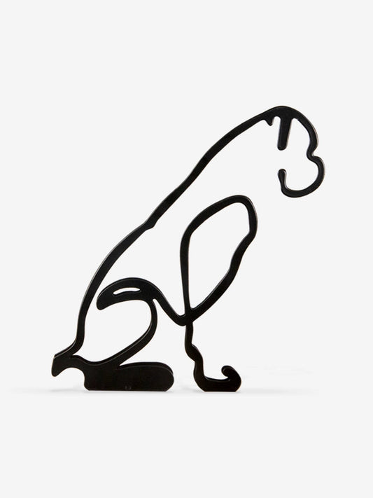 Black outline of a dog on a white background