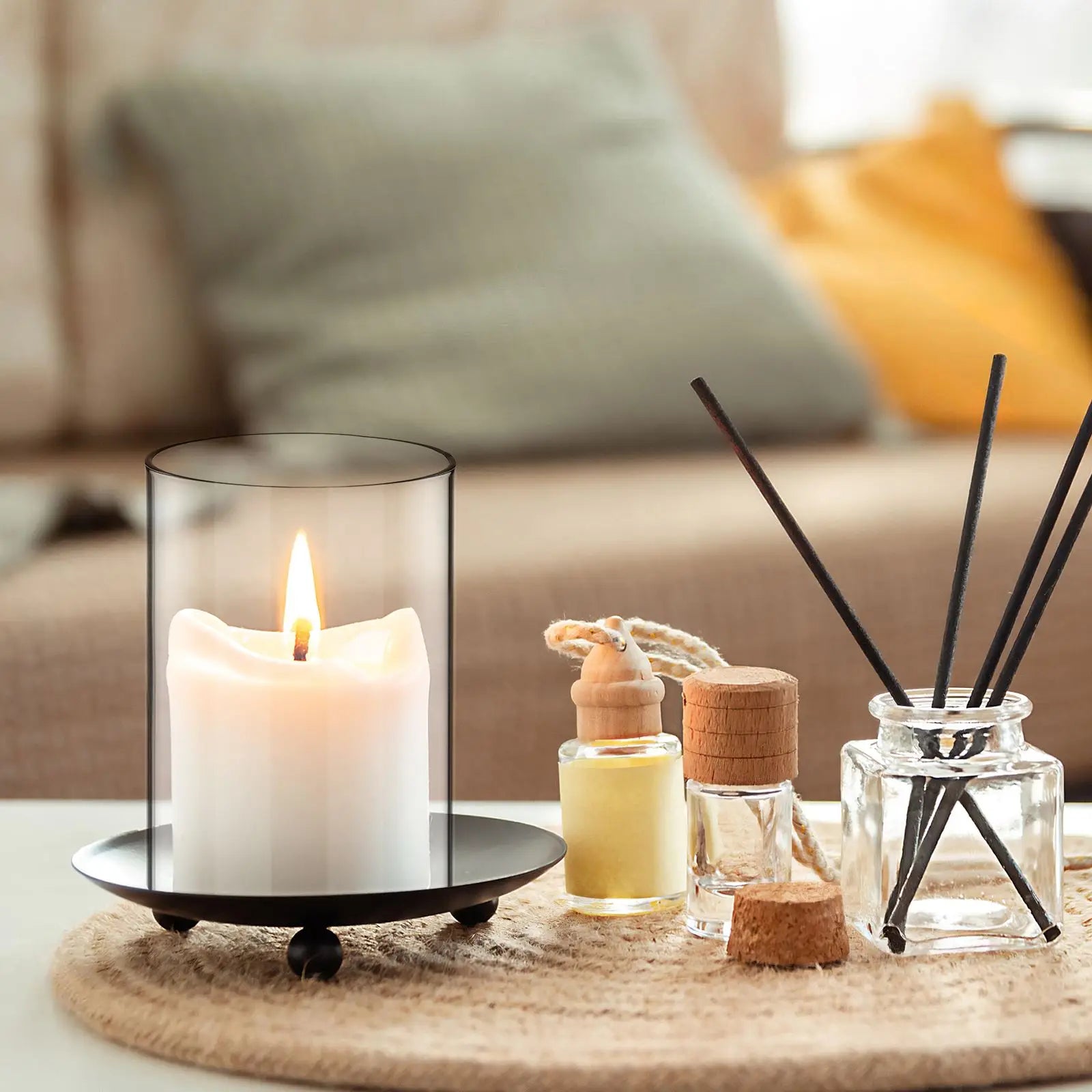 Candle and diffuser set on a table with a blurred background