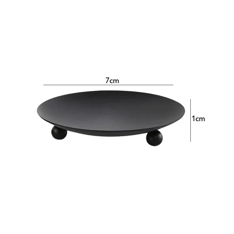 Black round stand with dimensions: Diameter 7cm, Height 1cm