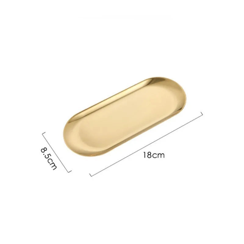Gold oval tray with dimensions: 18cm x 8.5cm
