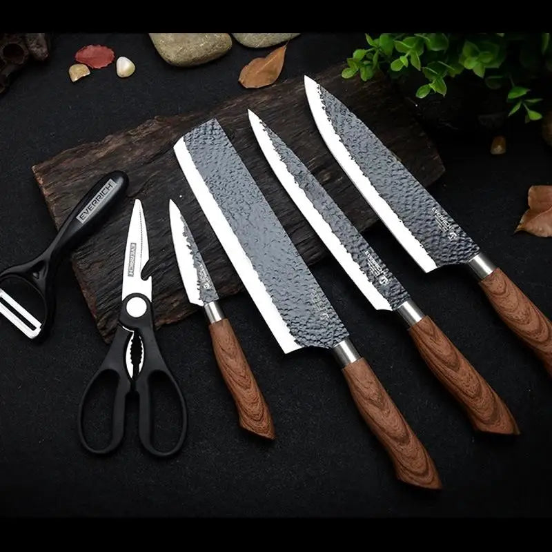 Set of knives with wooden handles on a dark surface