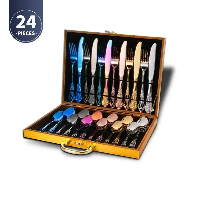 Set of 24 pieces of colorful cutlery in a wooden box on a white background