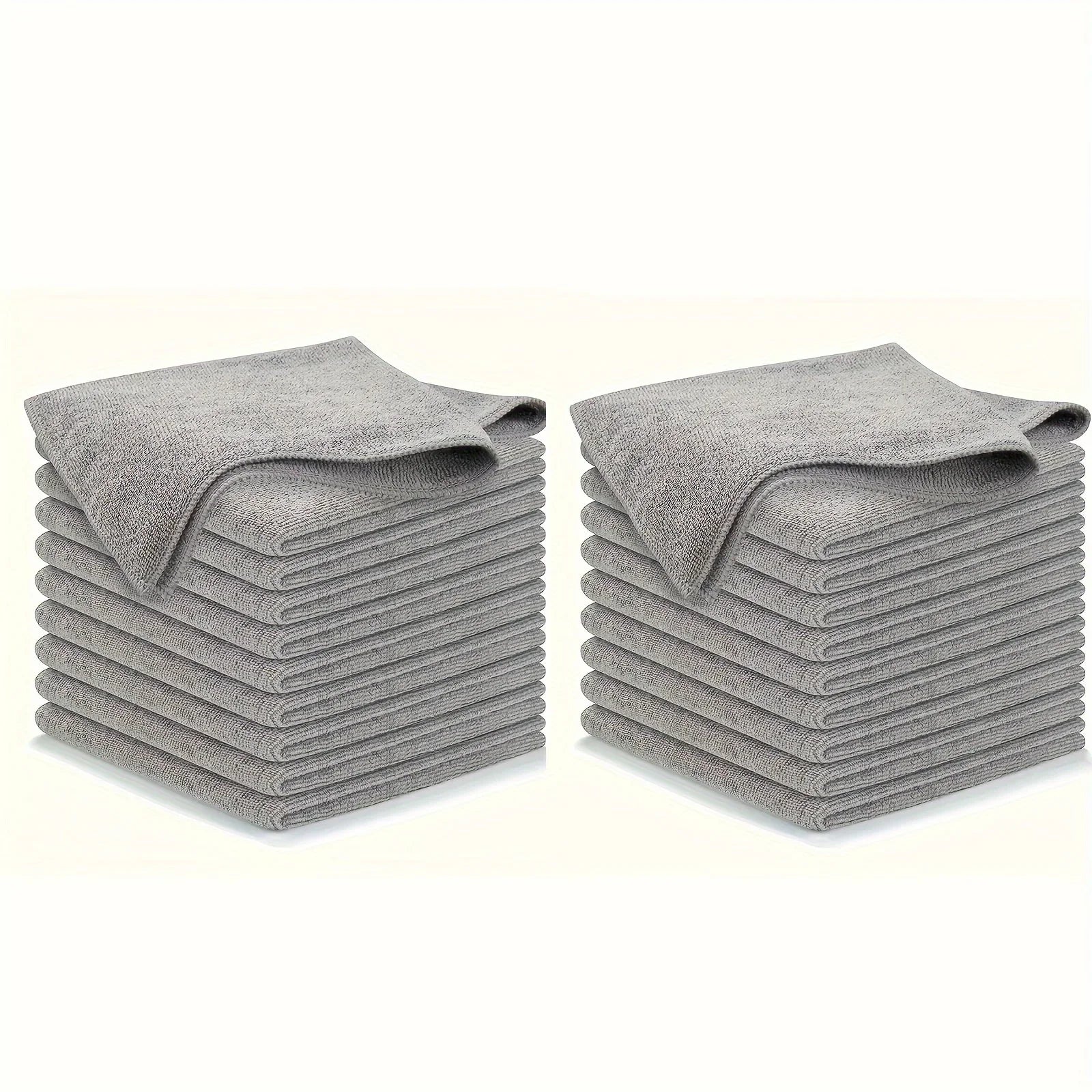 Two stacks of 10 gray towels on a white background