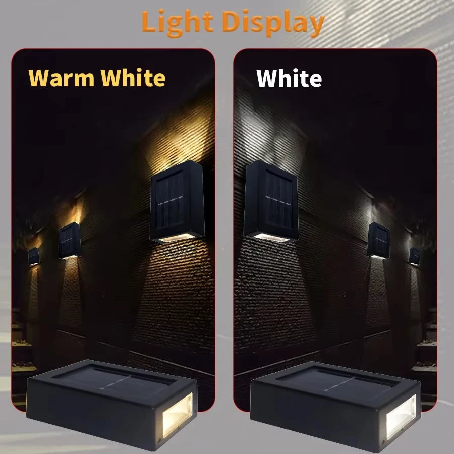 Two outdoor light fixtures on a textured wall, one labeled 'Warm White' and the other 'White', with a dark background.