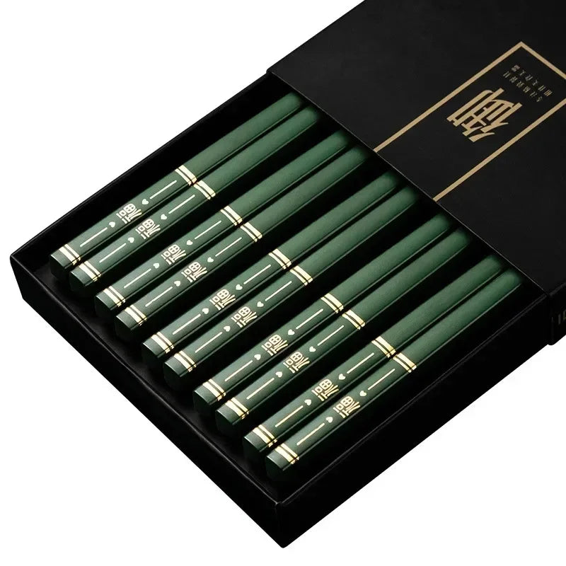Set of green pens with gold accents in a black box