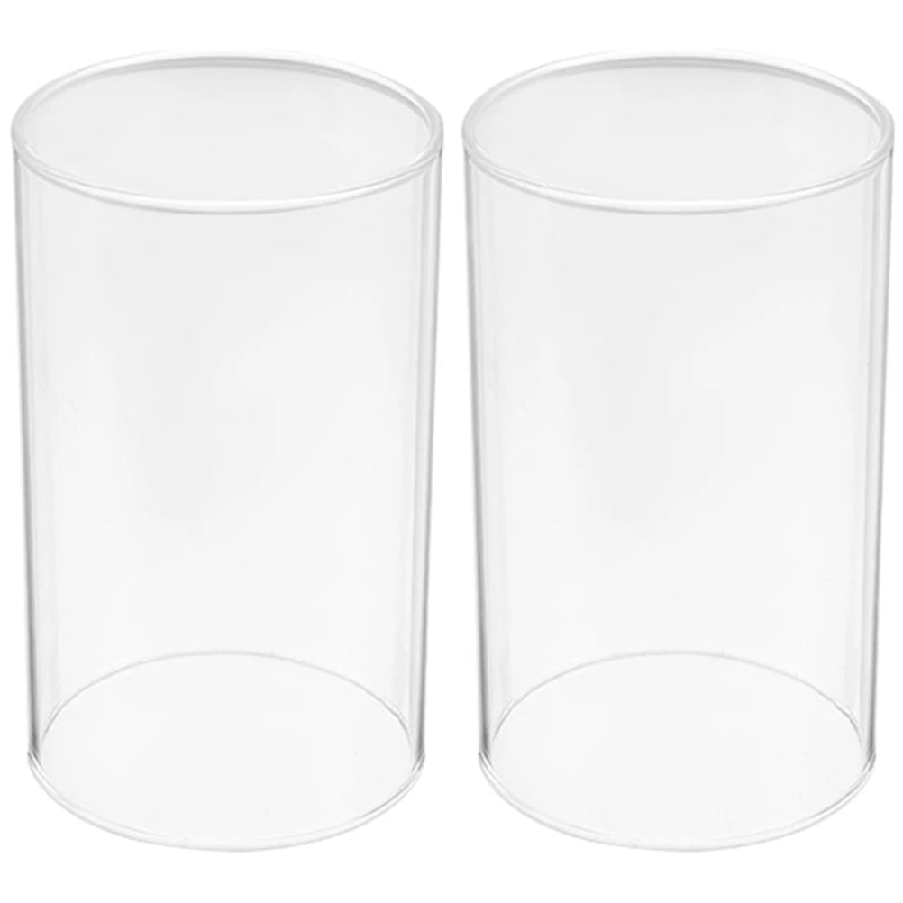 Two clear cylindrical glass containers on a white background