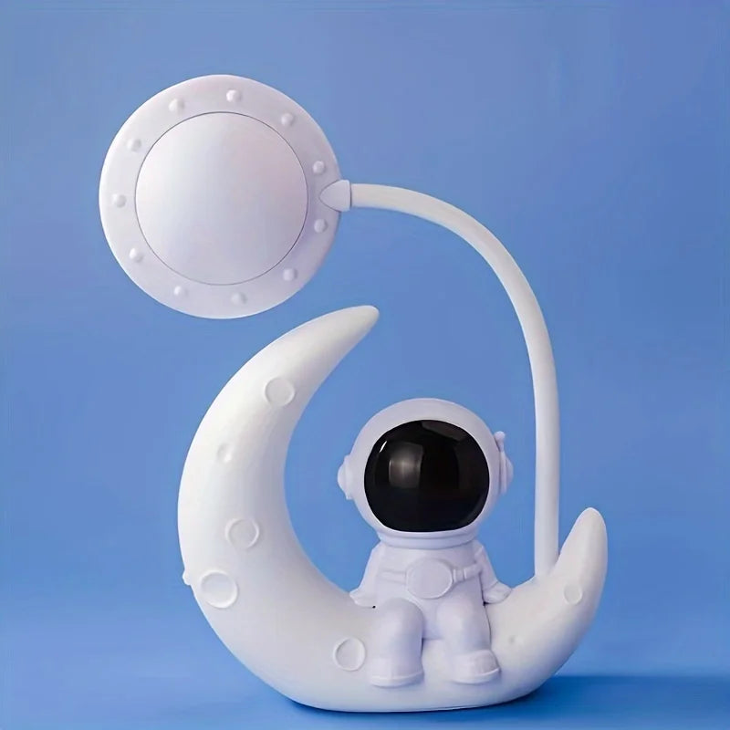 White astronaut figurine sitting on a crescent moon with a blue background