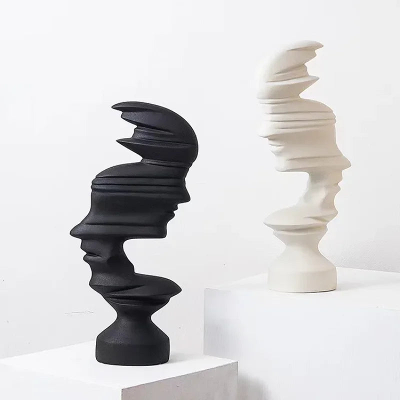 Black and white abstract sculptures on a white background