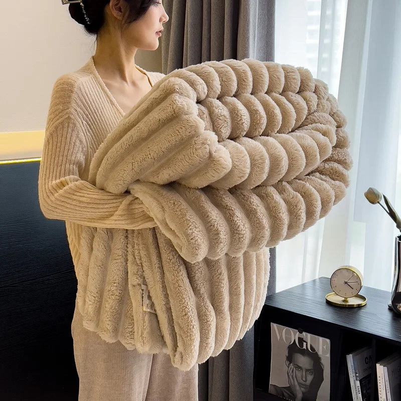 Person holding a large beige cushion in a room with a window and books on a shelf.