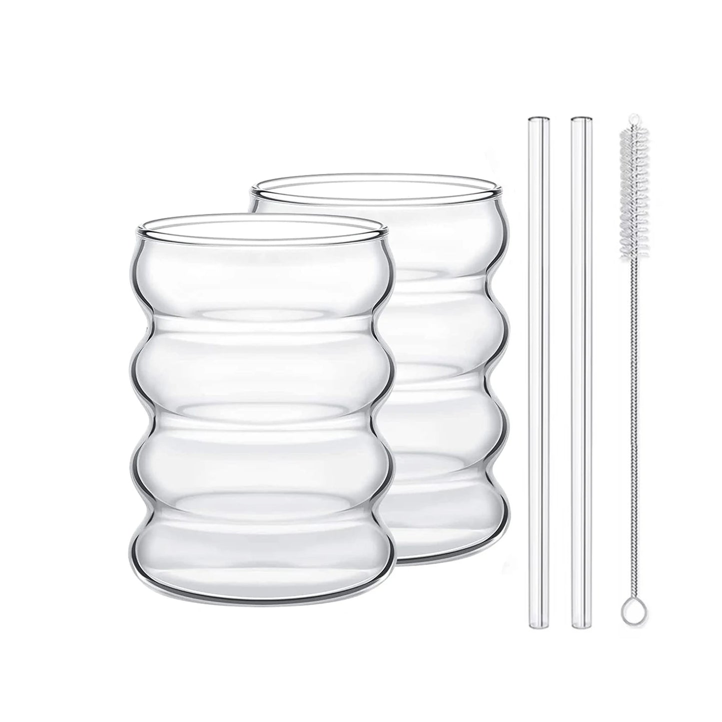 Two clear glass tumblers with two straws on a white background