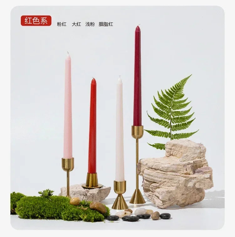 Set of candles in red tones s with decorative elements on a white background