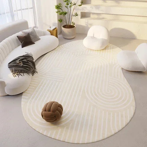 Round beige rug in a modern living room with white furniture and decor.