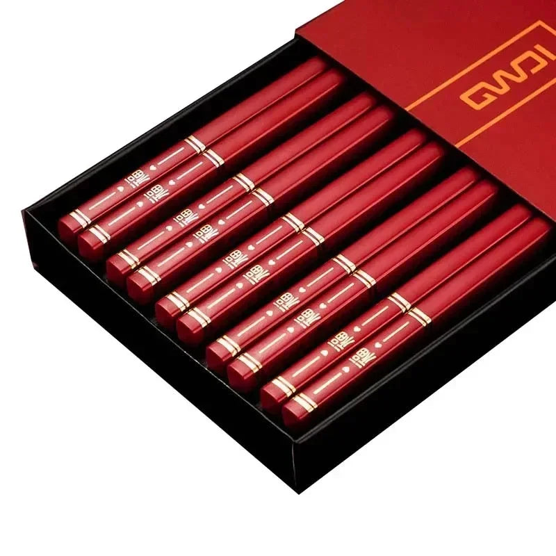 Set of red chopsticks with gold accents in a black box, featuring the brand name 'QWQ' on a white background.