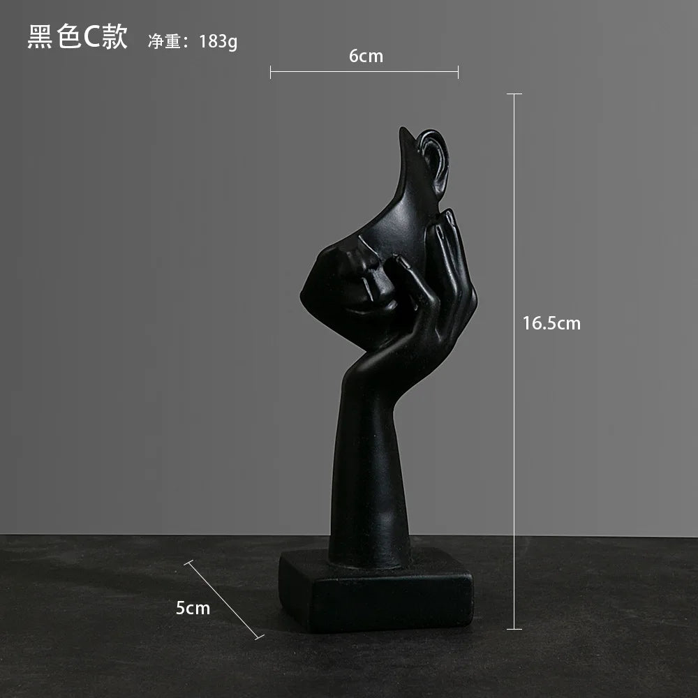 Black abstract sculpture with dimensions: 5cm x 16.5cm x 6cm