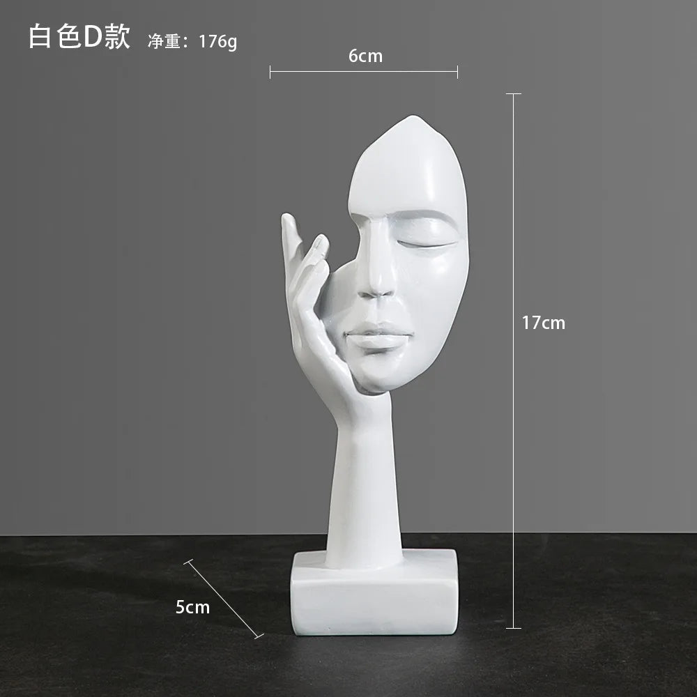 White sculpture of a face with a hand on a dark surface, with measurements:  5cm x 17cm x 6cm