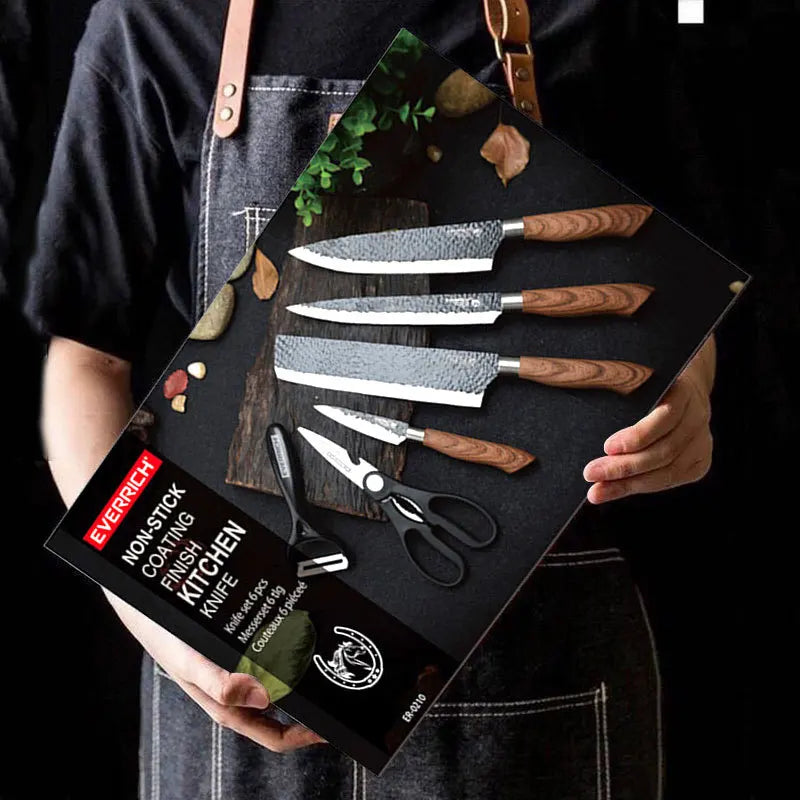 Person holding a set of knives in a branded box with a black background