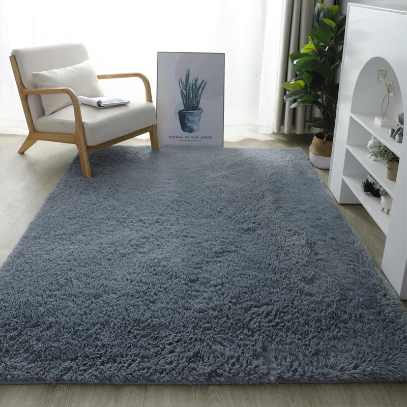 Pale blue shaggy rug in a living room setting with a chair and decor items.