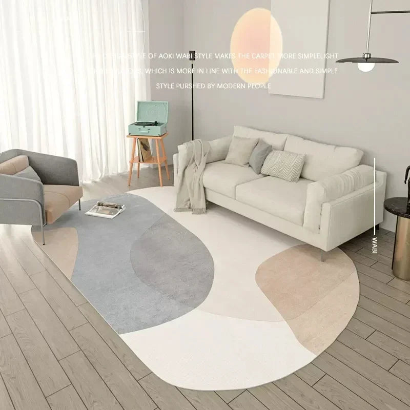 Modern living room with a round, multicolored rug and a white sofa.