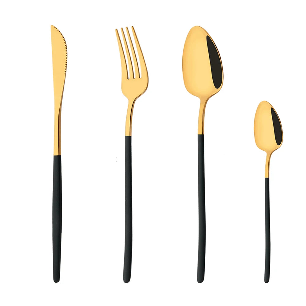 Set of gold and black cutlery including knife, fork, and two spoons on a white background