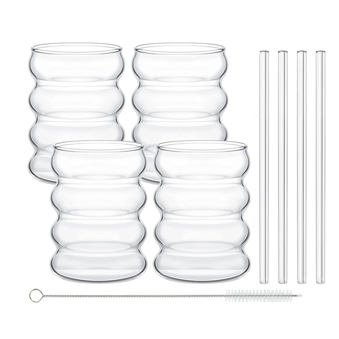 Set of clear glass tumblers with wave-like design and four straws on a white background