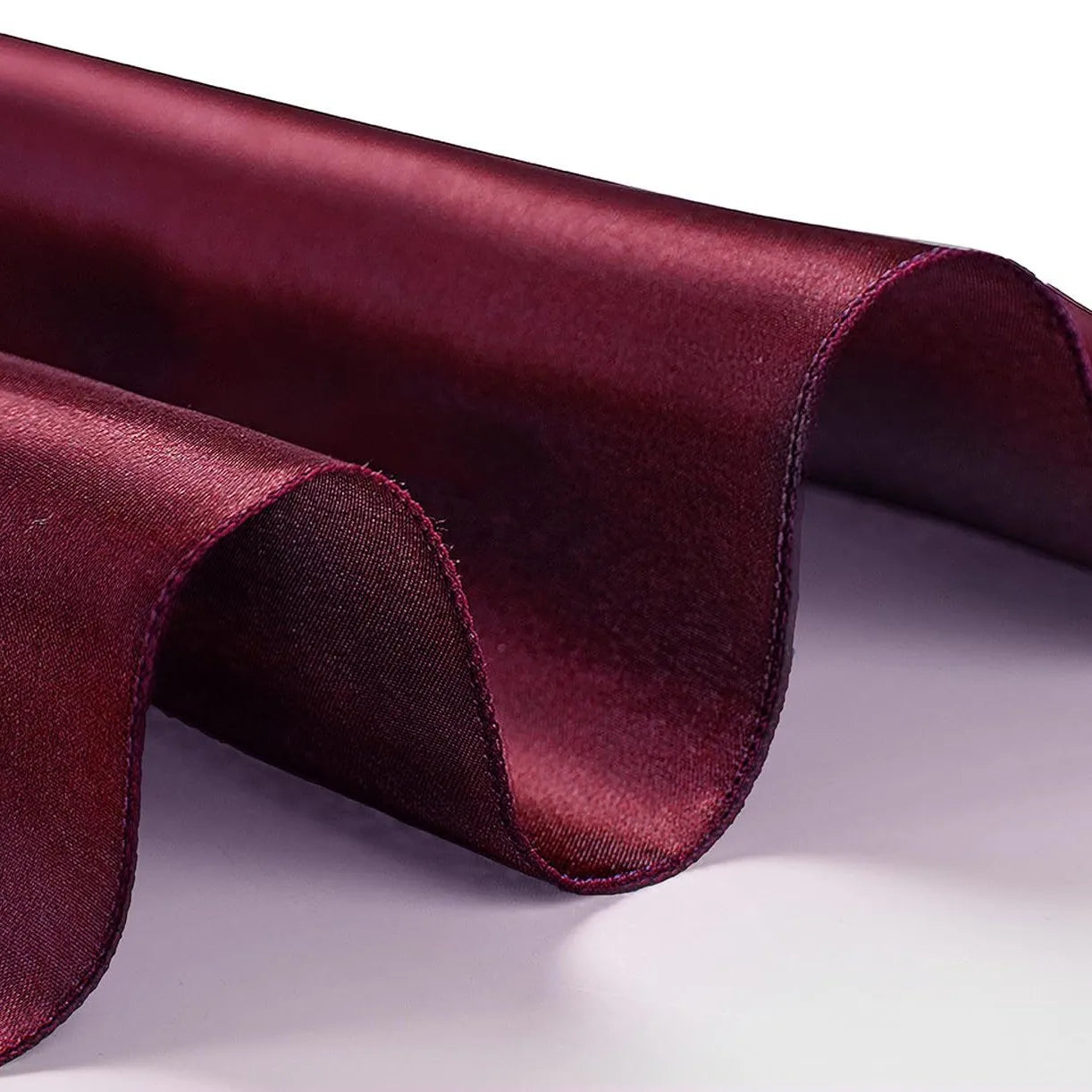 Close-up of Wine red fabric with a focus on texture and color.