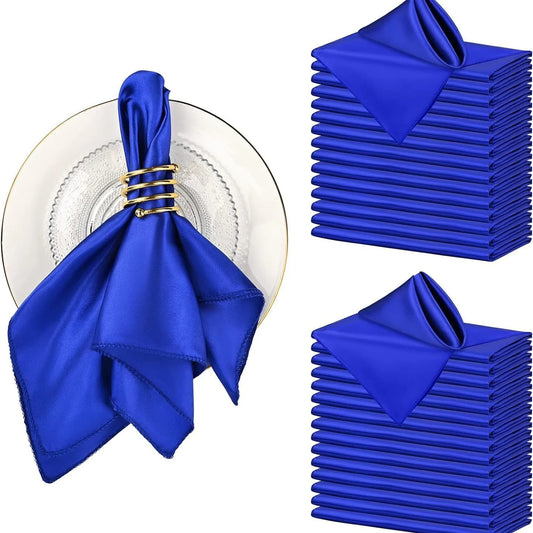 Set of blue napkins with a gold ring on a white background