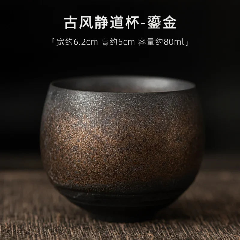 Dark brown ceramic cup on a textured surface with text overlay