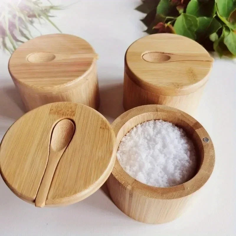 Set of wooden containers with lids on a light background
