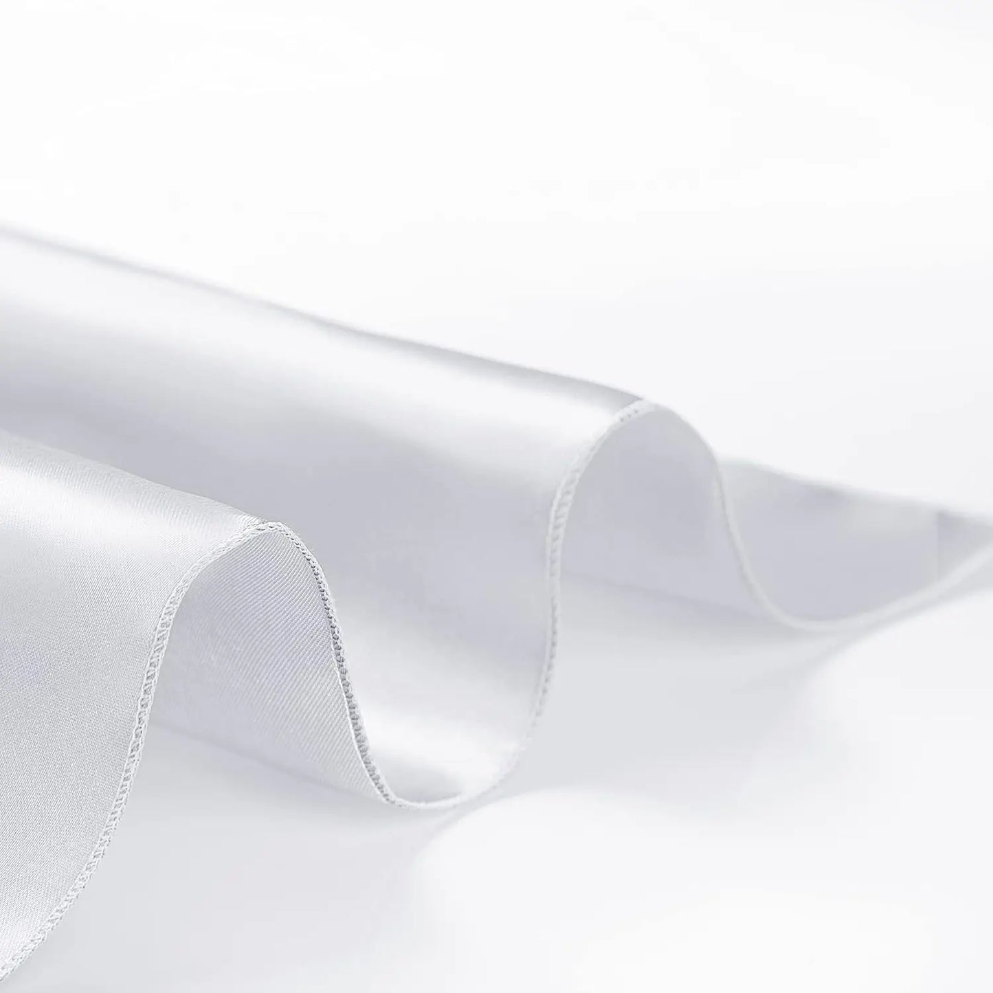 Close-up of a white shirt collar with a subtle texture.