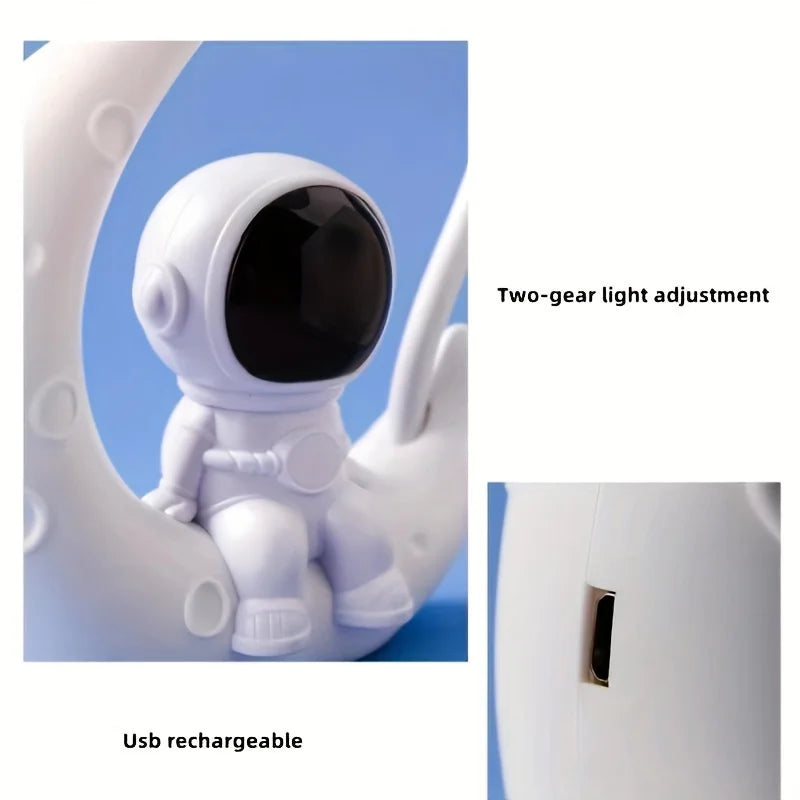 White astronaut-shaped night light with USB rechargeable feature and two-gear light adjustment on a blue background.