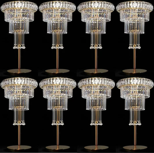 Multiple crystal chandeliers arranged in a grid on a black background