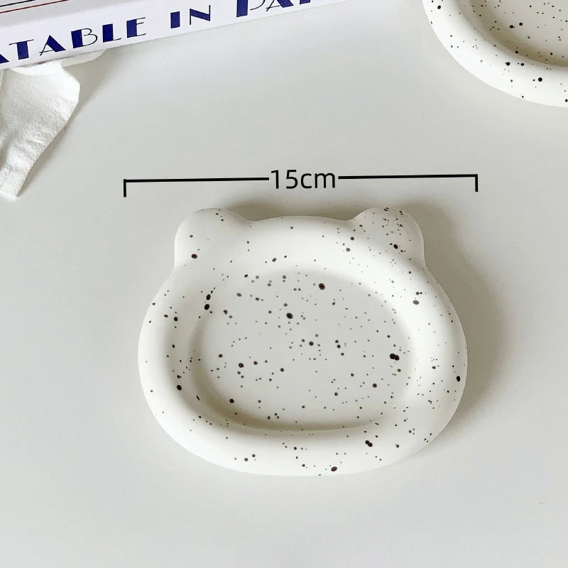 Speckled ceramic dish shaped like a cat with a measurements: 15cm